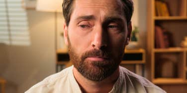 socially awkward man looking away from conversation