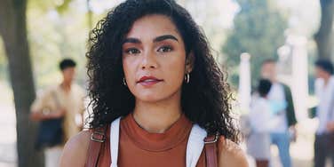 Strong young woman conquering her triggers confidently 