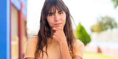 Woman who looks dubious and emotionally clueless 