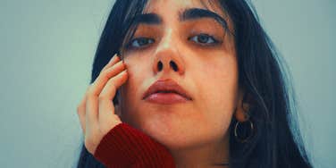 mentally and emotionally cruel woman looking serious
