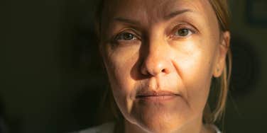 serious woman hiding mental and emotional rage