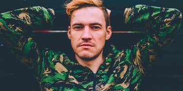 defensive man looking angry in camo