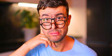 man with a high IQ playing dumb