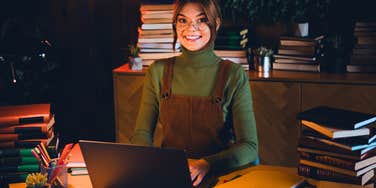intelligent woman wanting to learn sitting at her desk