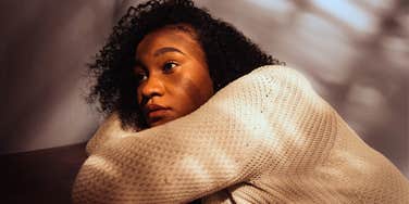 exhausted woman feeling anxious at home alone