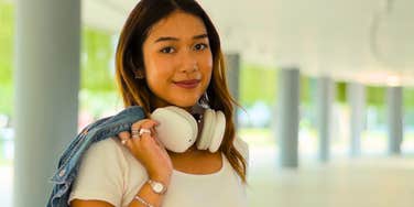 gen z woman wearing fashionable outfit outside