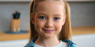 smiling spoiled child who never gets told no
