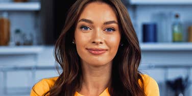 immature young woman smiling smugly