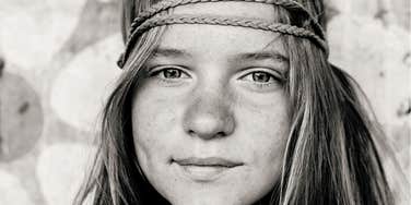 preteen girl raised in the 1970s wearing a headband