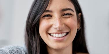 woman who is happy based on her social class