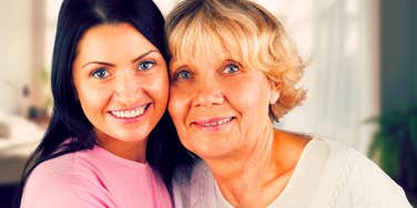 happy daughter hugging her older mom