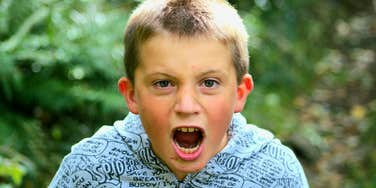 bratty little boy showing no gratitude yelling