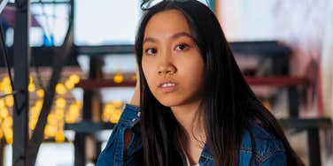 gen Z woman looking annoyed at confused at actions of older generations