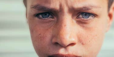 emotional boy upset at having needy parents