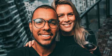 A young couple sharing a calm, affectionate moment outdoors, symbolizing emotional integrity, healthy communication, and relational security.