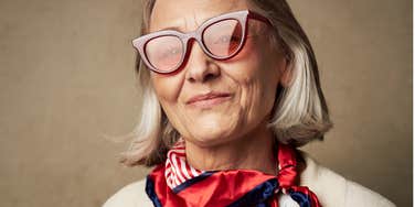 intelligent woman looking stylish and confident into camera