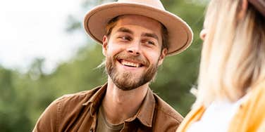 man with a strong relationship IQ smiles warmly at a woman