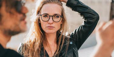 Woman who is her own worst enemy looking at another man 