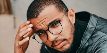 Man who is sharp but lacking common sense looks distressed