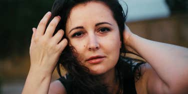 Woman with low integrity looks pleadingly into the camera 