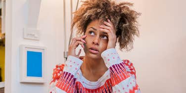 Woman with zero mental emotional confidence on the phone looking stressed