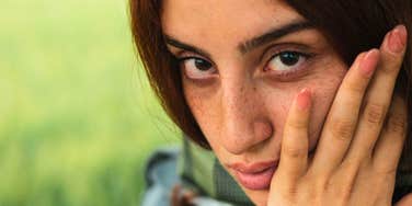 woman with weak resilience looking pensive