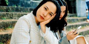 woman who is emotionally and mentally done with friend sitting by her