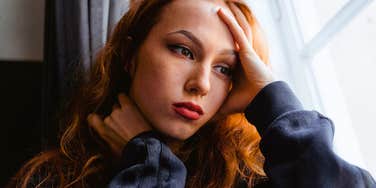 distracted unfocused woman deep in thought