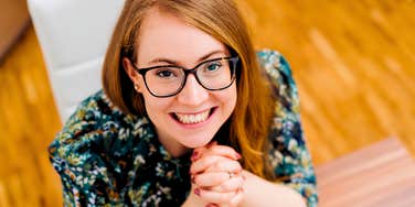 woman with integrity smiling at work looking happy
