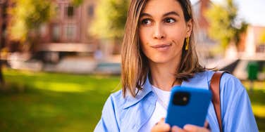 woman rolling her eyes at texts from her boomer parents