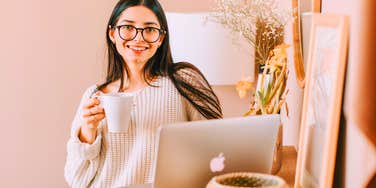 young professional working from home in monochromatic room