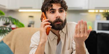 man with zero compassion angrily complaining at someone on the phone 