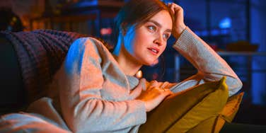 cozy woman watching her comfort shows alone on the weekend