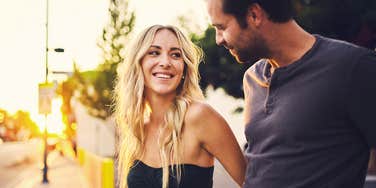 A close-up of a couple sharing an intimate, gaze-locked moment, representing 'affiliative bonding' and everyday linguistic validation in relationships.