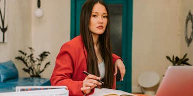 gen z professional woman looking serious in the office