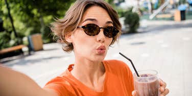 Gen-Z worker shows up with iced coffee.