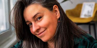 Woman with natural gray hair and easy, confident smile say she's got better things to do than fuss over looks.