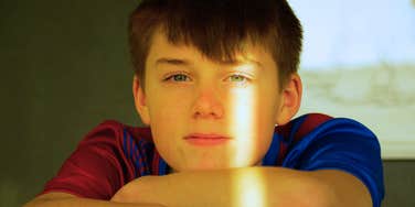 lonely boy by himself after parents gave him silent treatment