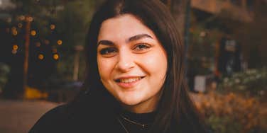 happy woman with high levels of self-respect smiling