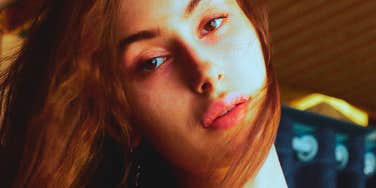sad woman who had a hostile mom growing up