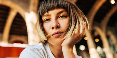 Her pensive, weary gaze reflects the quiet weight many adults carry from how they were raised.