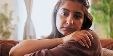 adult woman who grew up with parents who gave her trauma
