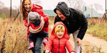 A family's joyful outdoor moment shows encouragement doesn't require one single parenting style.