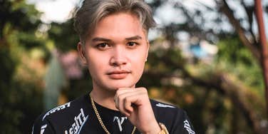 Passive-aggressive fashionable young man looking at camera with attitude