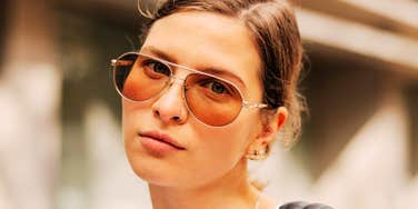 Her cool, guarded stare over sunglasses hints at the quiet negativity some people carry into relationships.