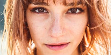 Woman with calm, steady gaze, embodying composure of someone with high emotional integrity