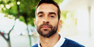 Man's steady, composed gaze reflects the calm confidence of a professional, well-placed no.