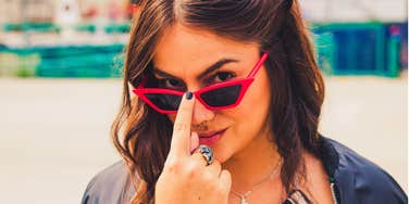 privileged snobby young woman smirking
