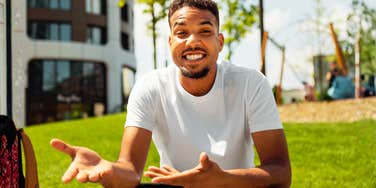 Man gestures animatedly mid-explanation, all confident energy and open hands, saying plenty at a glance.