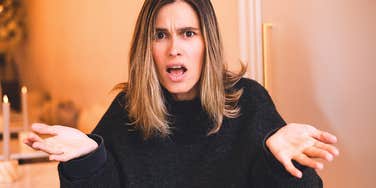Woman with low emotional maturity looks shocked 